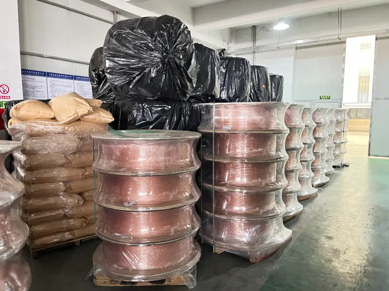 Raw material copper coils stored in the warehouse of an insulated copper tube manufacturer and supplier
