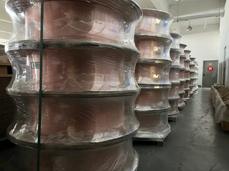 Palletized copper tube coils in the storage warehouse of a copper tube manufacturer