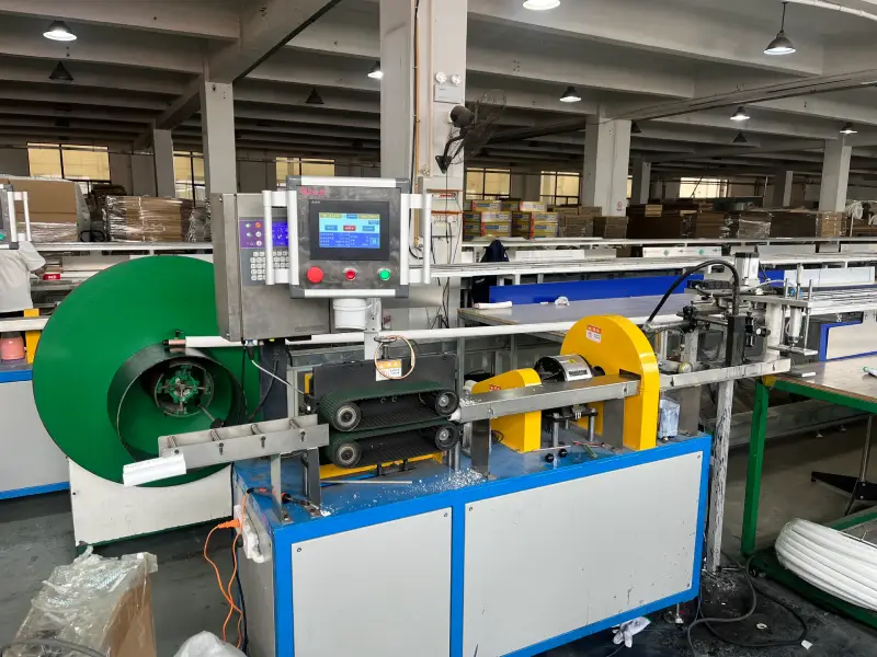 Copper tube manufacturer's automated haul-off machine with control panel on insulated copper tube production line